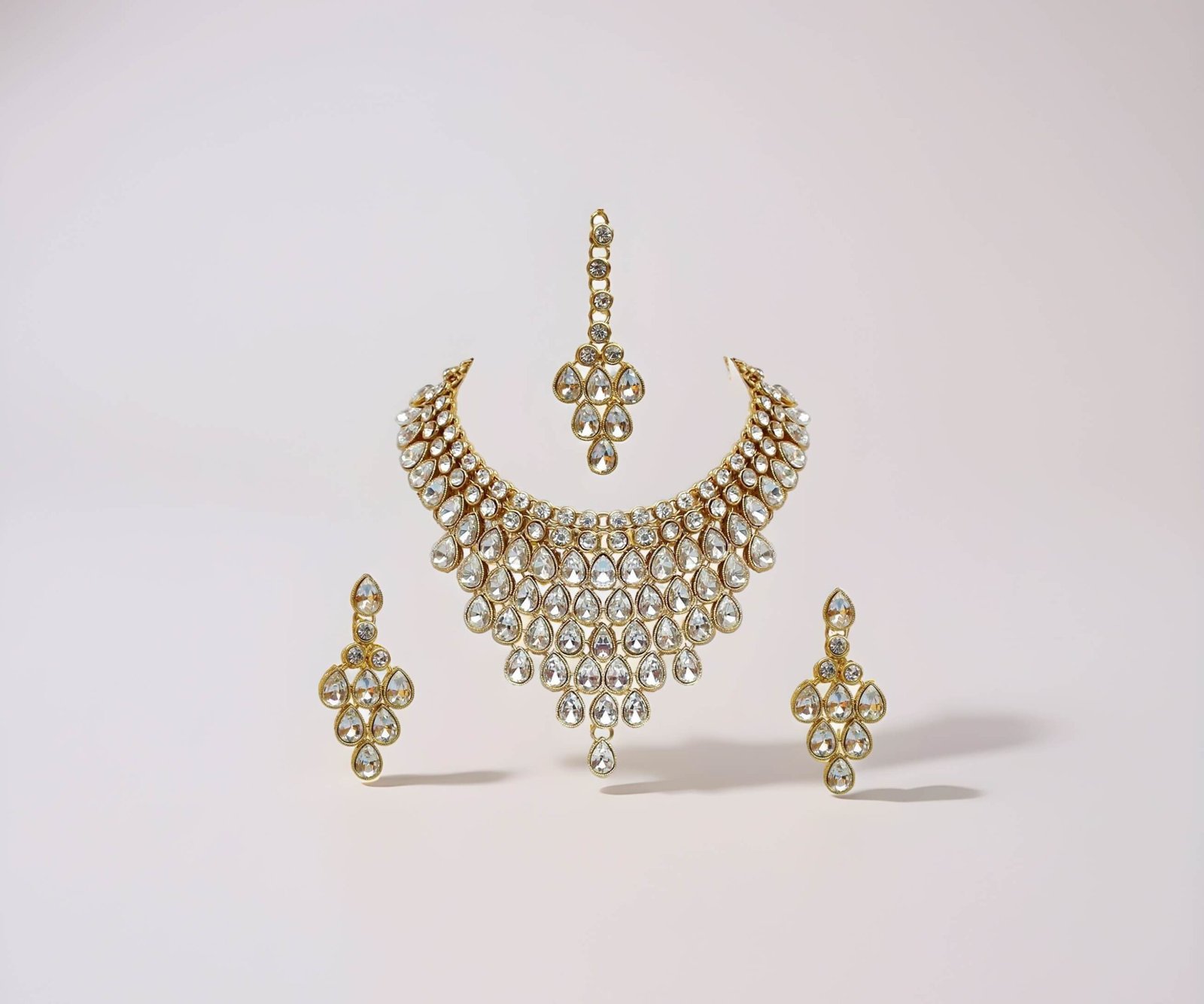 traditional gold plated stone studded bridal choker necklace set earrings & maang tikka for women1 (1) traditional gold plated stone studded bridal choker necklace set earrings & maang tikka for women1 (1)